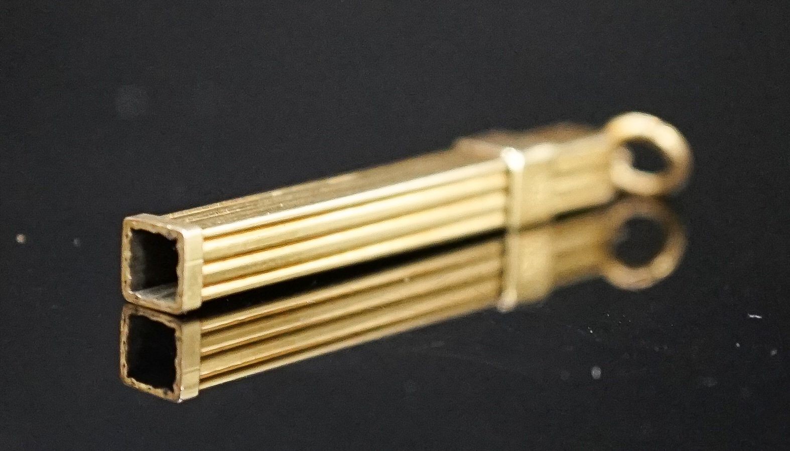 A yellow metal mounted tortoiseshell propelling toothpick, 52mm.